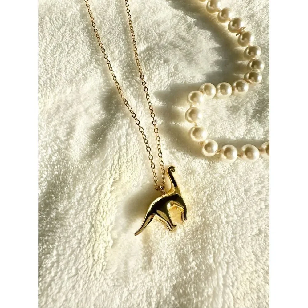 Gold color brachiosaurus pendant necklace